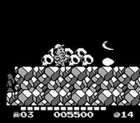 une photo d'Ã©cran de Adventure Island 2 - Aliens in Paradise sur Nintendo Game Boy